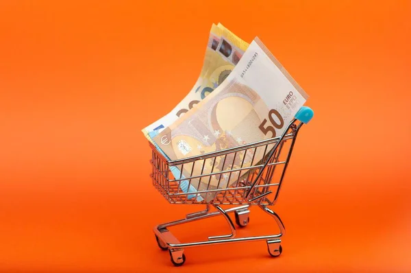 Euro Banknotes Different Nominals Shopping Cart Bright Orange Background — Stock Photo, Image