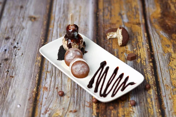 Dessert Made Ice Cream Draped Chocolate Sauce Brownie Macarons Wooden — Stock Photo, Image