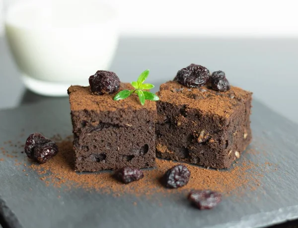 Closeup Two Slices Chocolate Brownies Cherries Cocoa Powder — Stock Photo, Image