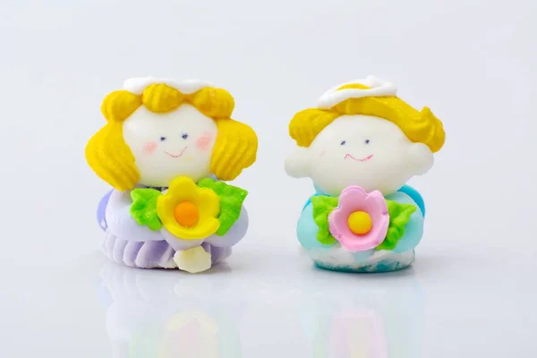 A closeup of cute doll lovers isolated on a white background