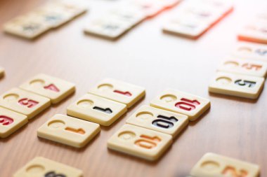 Rummy game on a table with a spot of natural light
