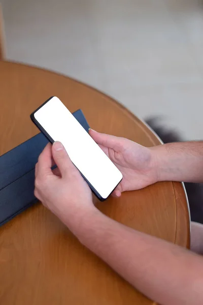 Hands Holding Cell Phone Blank Screen Wooden Table —  Fotos de Stock