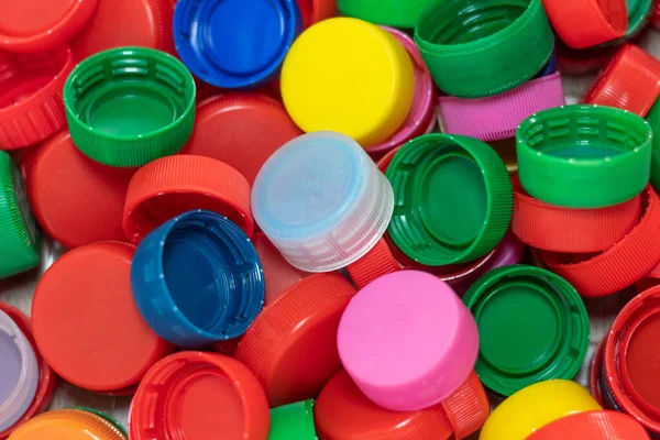 Close up of many colored plastic bottle caps