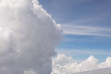 Close up of a huge cloud with blue sky in the background