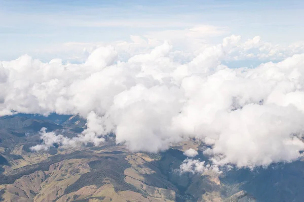 Big clouds over Colombian mountains seen from the sky