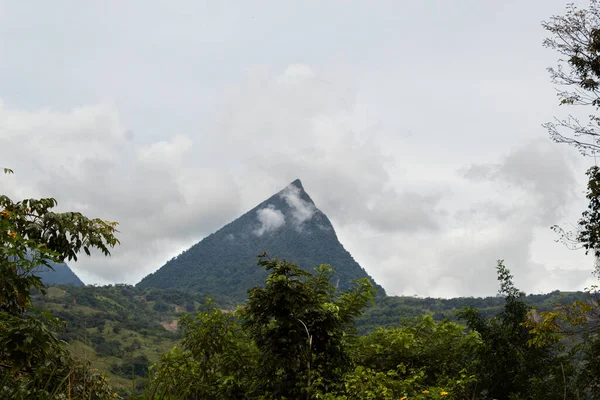 Pyramid Shaped Mountain Clouds Front Lots Vegetation Foreground Cerro Tusa — Stockfoto