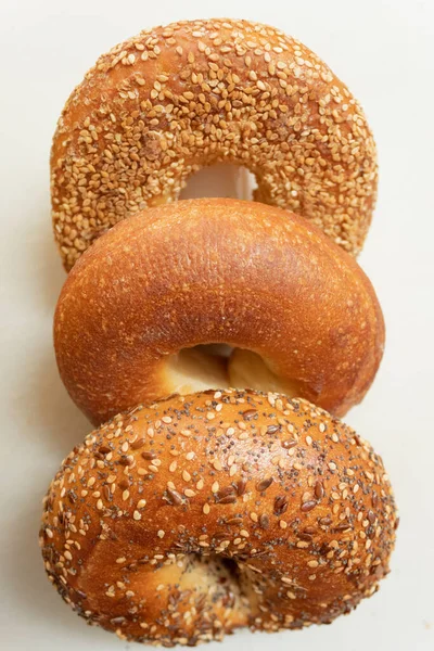 Three Fresh Bagels Row White Background Sesame Bagel Plane Bagel — Stock Photo, Image