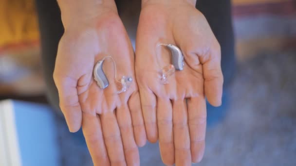 Showing Modern Hearing Aids Both Hands — Video Stock