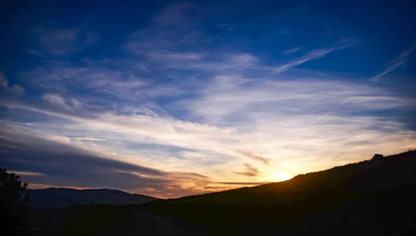 Marin County Sun Setting Over Hills Blue Cloudscape