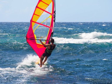 Surfing blue water wind in Pacific Ocean in the summer in Hawaii on a holiday.  Brilliant nature outdoors great horizon.