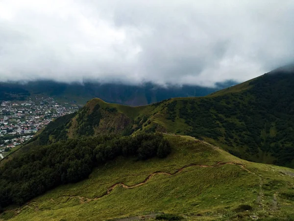 Mountain landscape from the circumference of the Georgian centuries-old temple of Gergeti.