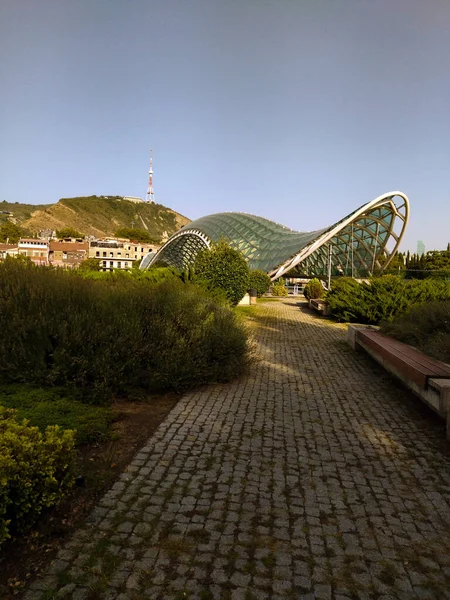 The Peace Bridge in Tbilisi blends perfectly with the architecture of the old city