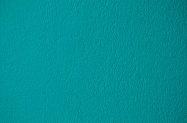 Doku tasarımı için yeşil renkli çimento duvar arka planı. Soyut turkuaz sıva yüzeyi.