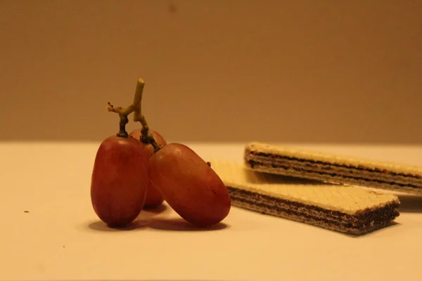 a piece of a chocolate with an apple on it is a symbol of a healthy life and a new