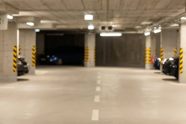 Garage interior blurred. Car lot parking space in underground city garage. Large private garage. High quality photo
