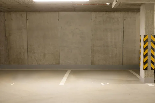 Parking garage underground. Empty car park at underground building. High quality photo