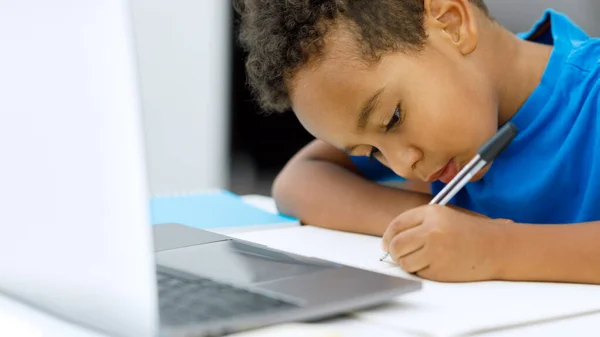 Serious African American Schoolboy Studying Online Laptop Home Sitting Table — Stock Photo, Image