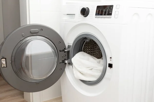 A loaded washing machine with dirty or clean laundry. High quality photo