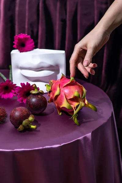 Creative Modern Still Life Made Purple Satin Flowers Exotic Fruits — Stock Photo, Image