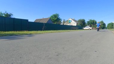 Man riding electric bike down the street