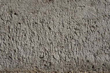 Yüzeyin dokusunu gösteren gri bir beton bloğu kapat