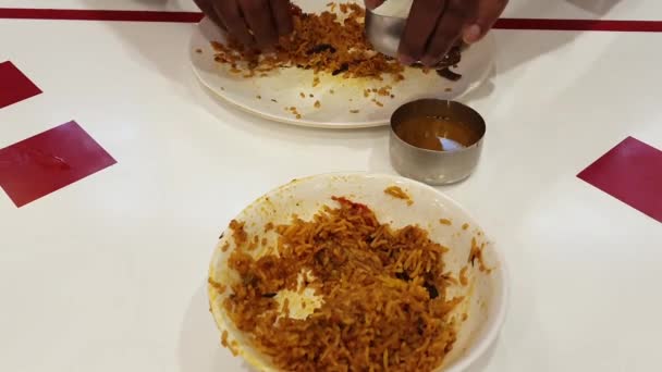 Man Eating Indian Popular Food Chicken Biriyani Served Curd Curry — Stockvideo