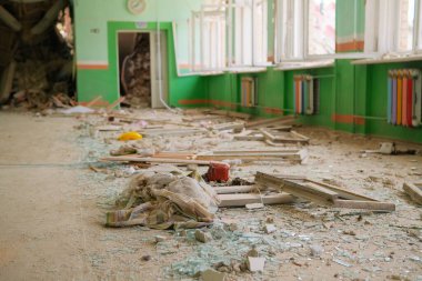 Consequences of the bomb dropped on the school. Russian military attacks from the air. School interior.