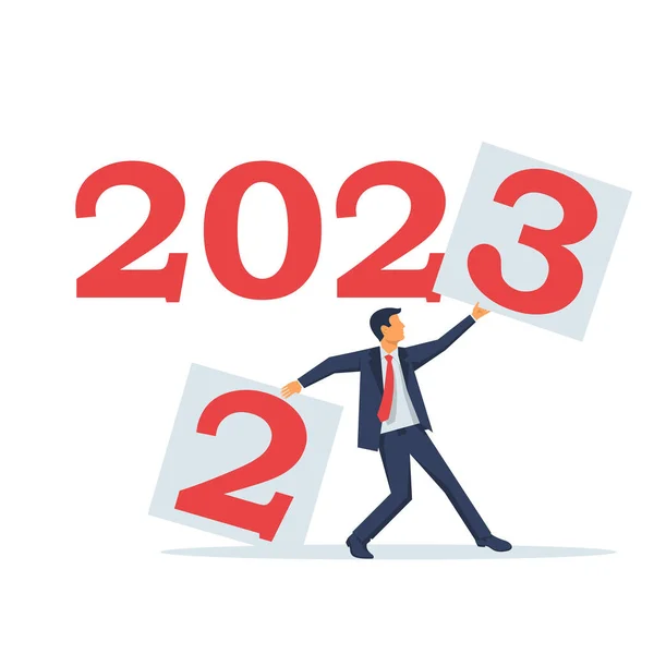 2022年 年を変えろ ビジネスマンは2でシートを涙し 新年を2023に設定します ベクトルイラストフラットデザイン 白地に隔離された — ストックベクタ