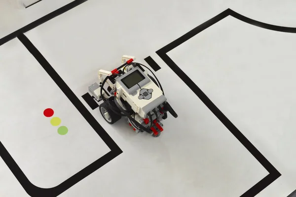 small robot driving on painted roads. handmade model design of electonic machine or car. IT Modeling