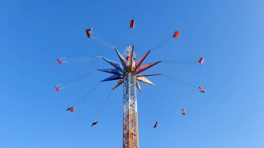 people on an attraction in a city park 