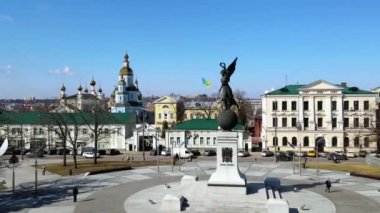 Monument and church on the square in the city center of Kharkov 