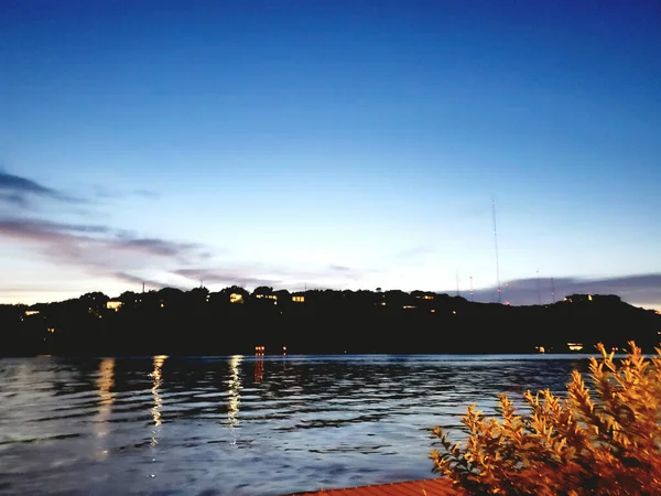 Gazing across the lake at dusk