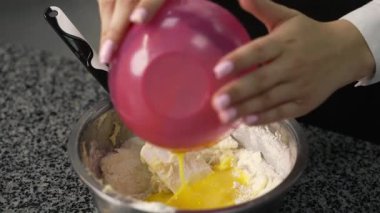 young girl chef makes desserts. bakes sweets and cakes. makes blanks and prepares fruits for the filling. baking, dessert, sweets, complex cooking processes.