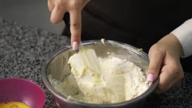 young girl chef makes desserts. bakes sweets and cakes. makes blanks and prepares fruits for the filling. baking, dessert, sweets, complex cooking processes.
