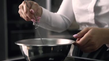 young girl chef makes desserts. bakes sweets and cakes. makes blanks and prepares fruits for the filling. baking, dessert, sweets, complex cooking processes.