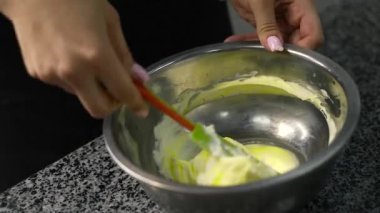 young girl chef makes desserts. bakes sweets and cakes. makes blanks and prepares fruits for the filling. baking, dessert, sweets, complex cooking processes.