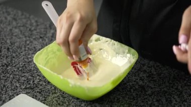 young girl chef makes desserts. bakes sweets and cakes. makes blanks and prepares fruits for the filling. baking, dessert, sweets, complex cooking processes.
