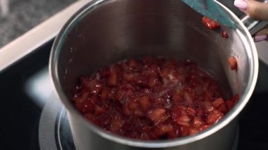 young girl chef makes desserts. bakes sweets and cakes. makes blanks and prepares fruits for the filling. baking, dessert, sweets, complex cooking processes.