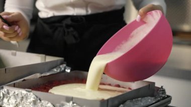 young girl chef makes desserts. bakes sweets and cakes. makes blanks and prepares fruits for the filling. baking, dessert, sweets, complex cooking processes.