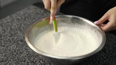 young girl chef makes desserts. bakes sweets and cakes. makes blanks and prepares fruits for the filling. baking, dessert, sweets, complex cooking processes.