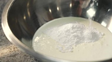 young girl chef makes desserts. bakes sweets and cakes. makes blanks and prepares fruits for the filling. baking, dessert, sweets, complex cooking processes.