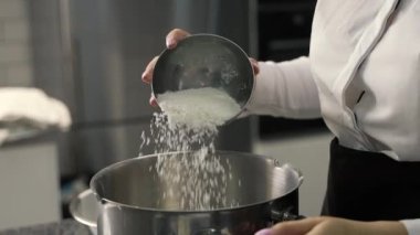 young girl chef makes desserts. bakes sweets and cakes. makes blanks and prepares fruits for the filling. baking, dessert, sweets, complex cooking processes.