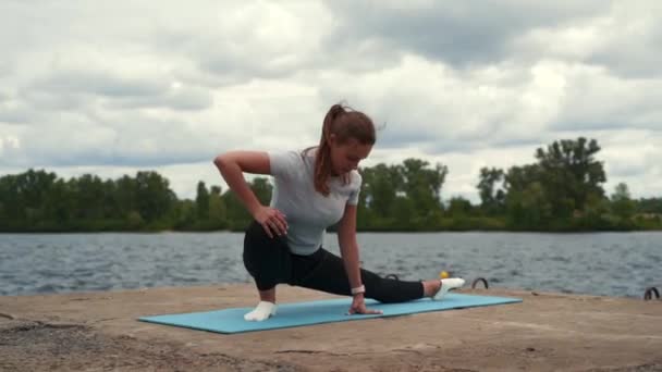 Sports Girl Doing Stretching River — Stock Video