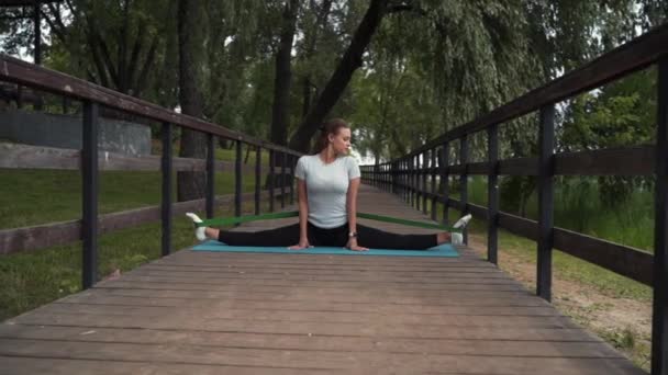 Girl Goes Sports Does Stretching Park Bridge — Vídeo de Stock