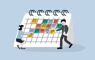 Takvim iş bitiş tarihi, çalışma projesi planı, randevu ya da toplantı konsepti için hatırlatma. İş adamı ve iş kadını, iş planının post-it kağıtlarını büyük takvime kısa notlar yapıştırıyorlar..