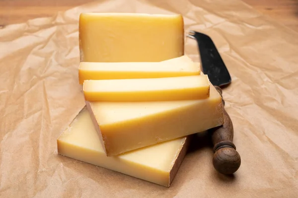 stock image French cheese collection, comte cheese made from unpasteurized cow's milk in Franche-Comte region, France