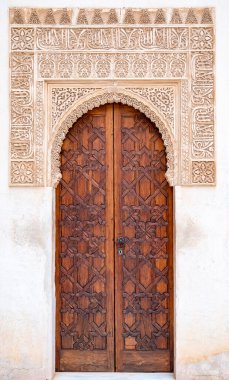 Example of medieval geometrical ornaments on old wooden doors in Granada, Andalusia, Spain