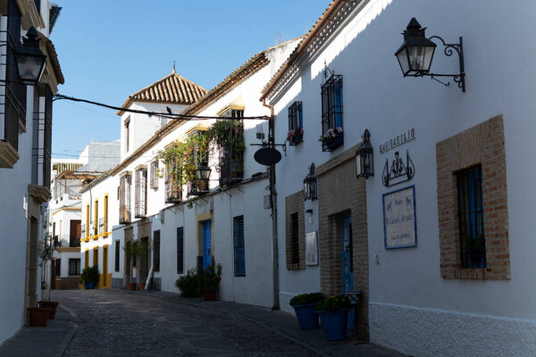 View on old part of Cordoba, San Basilio quarter with white houses and flowers pots in summer