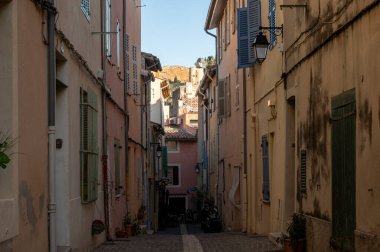 Sunny day in South of France, walking in ancient Provencal coastal town Cassis, narrow streets and colorful buildings, Provence, France in spring