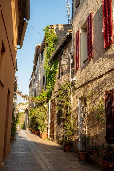 Sunny day in South of France, walking in ancient Provencal coastal town Cassis, narrow streets and colorful buildings, Provence, France in spring